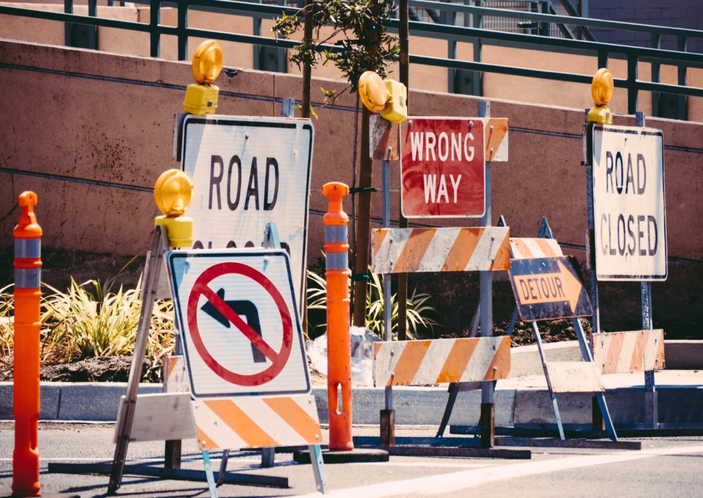 Wrong way road signs blocking a street