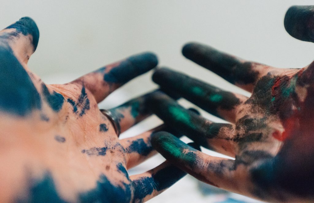 Hands full of paint