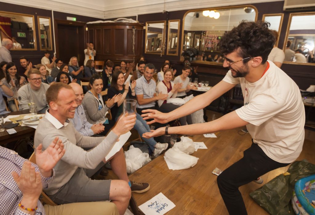 Speaker and audience laughing at Pint of Science Festival