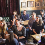Science Communication: Crowd with 3D glasses in bar during Pint of Science event