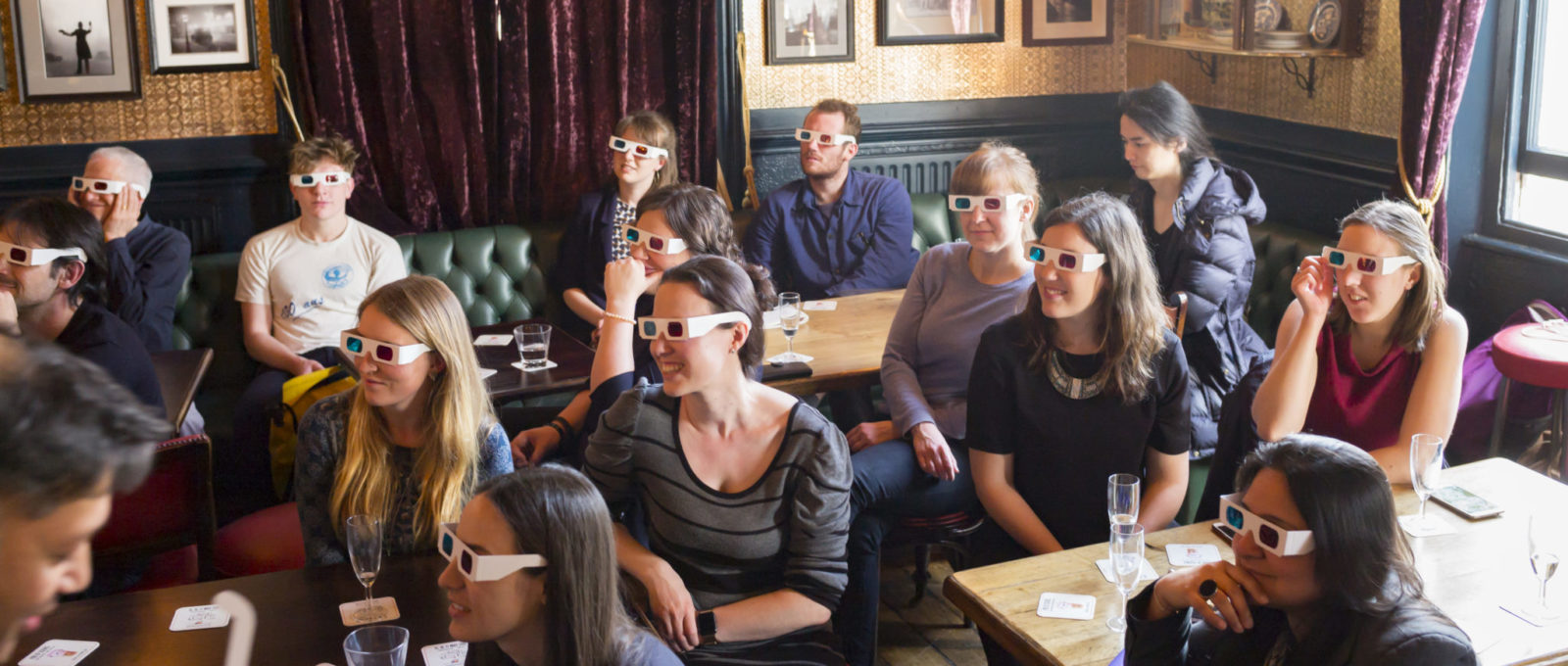 Science Communication: Crowd with 3D glasses in bar during Pint of Science event