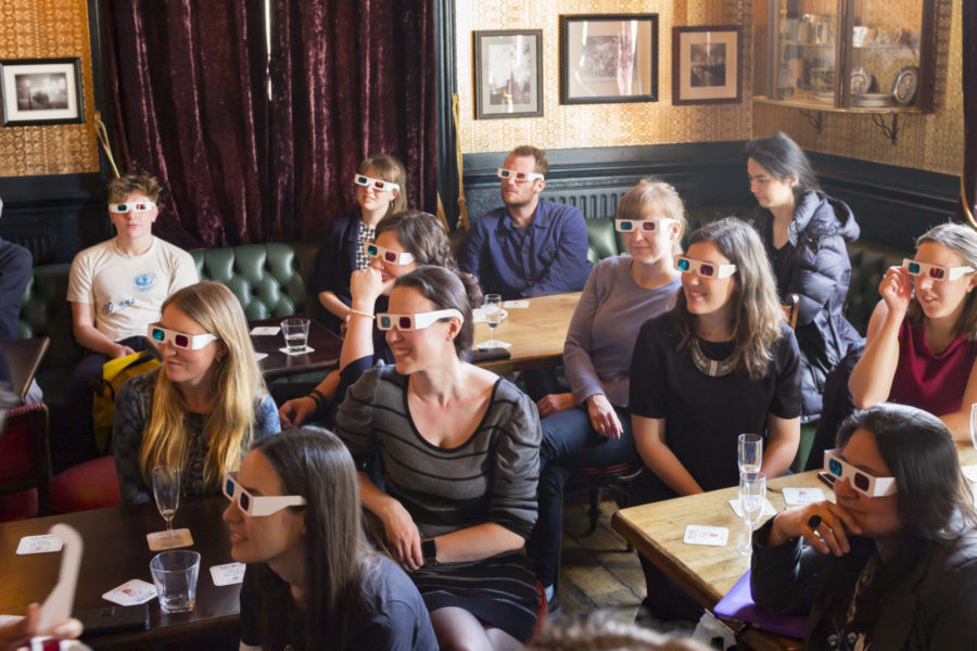 Science Communication: Crowd with 3D glasses in bar during Pint of Science event