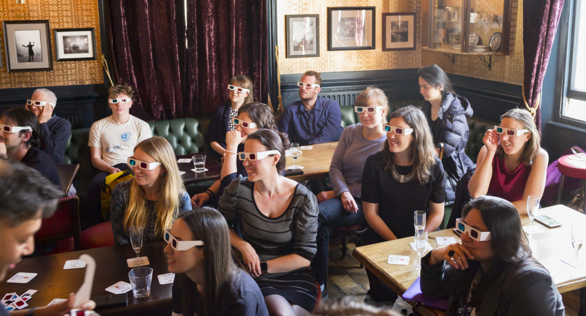 Science Communication: Crowd with 3D glasses in bar during Pint of Science event
