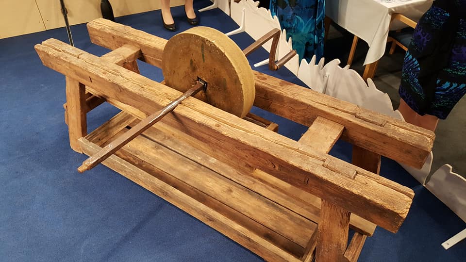 The hand-turned grindstone on which the newly awarded PhD sharpens their sword