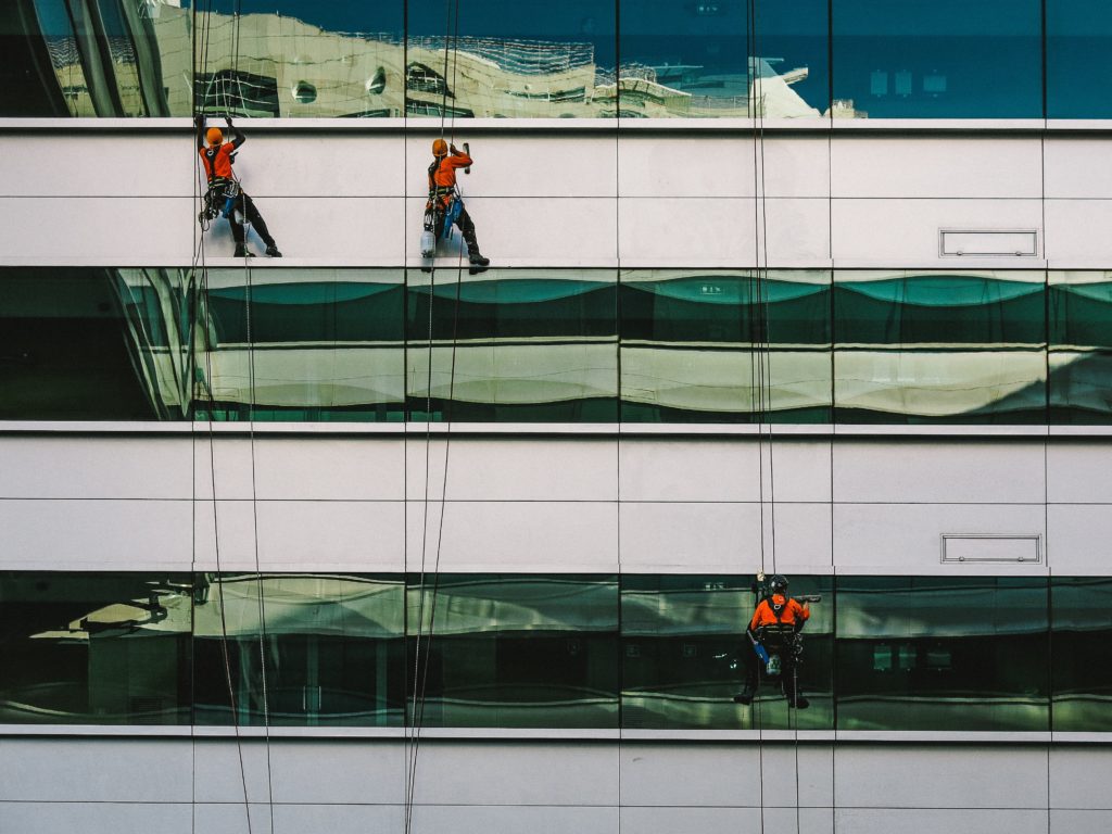 Window cleaners on building facade