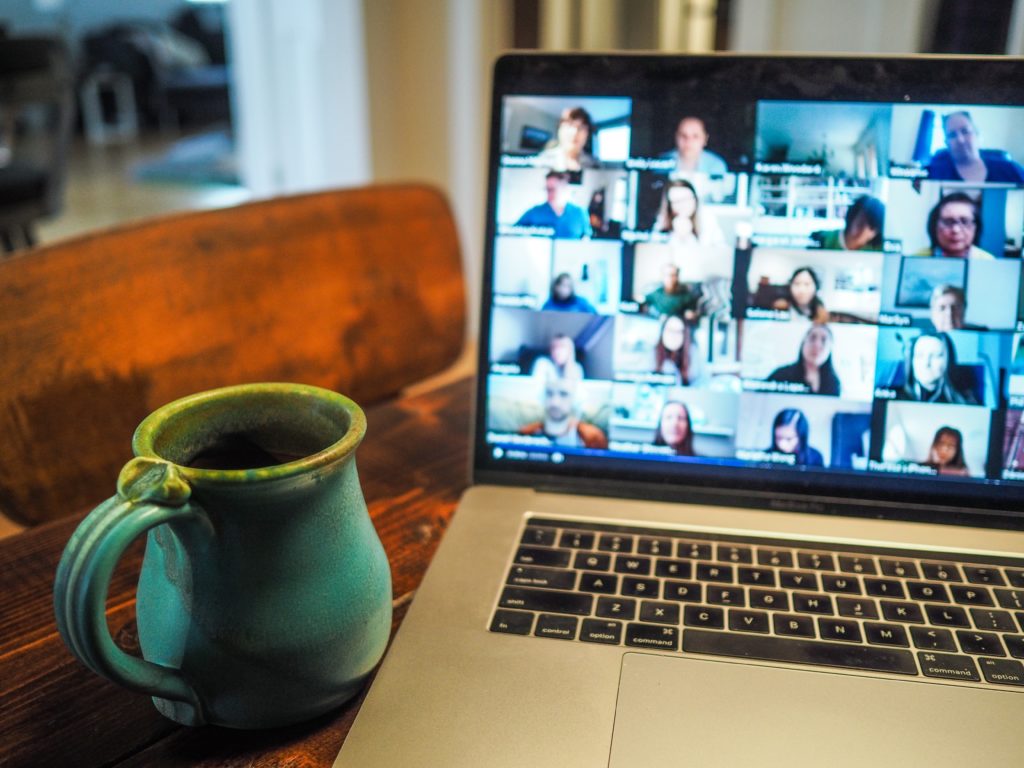 People exchanging PhD experiences over a group video call